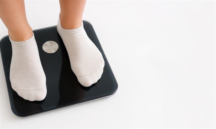 Personne sur une balance